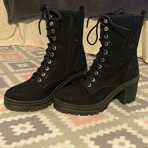 Boots with heels. Color black and sparkly. Size 5.5